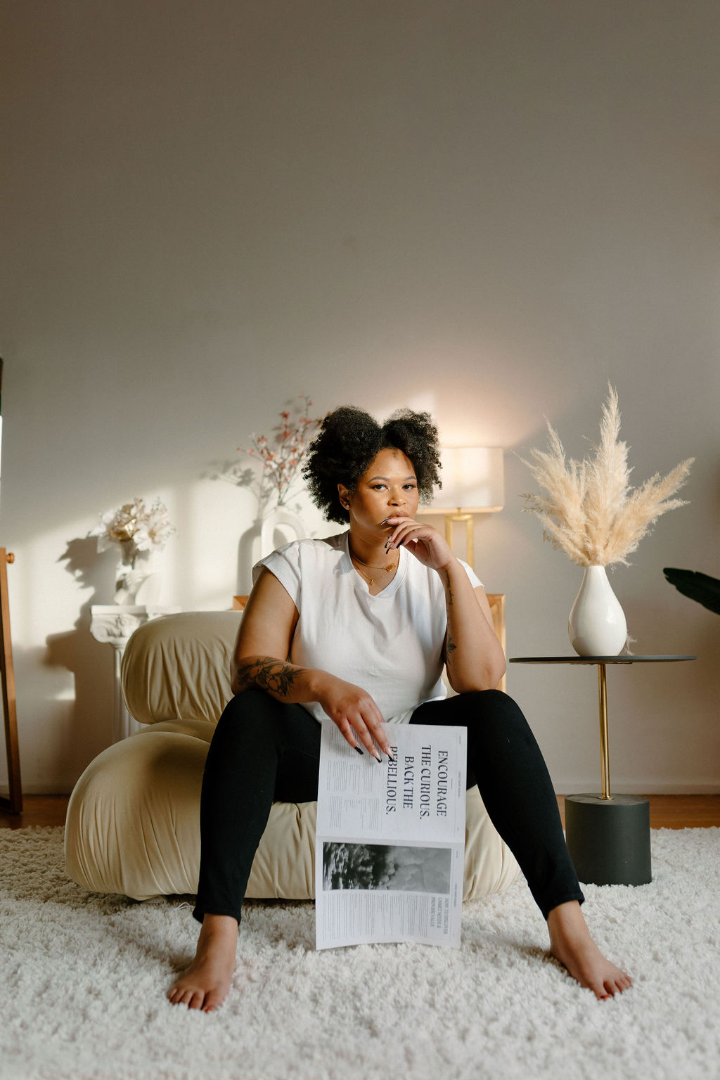 Black woman on white couch